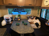 Experience ultimate comfort in this RV rental! Pets, cozy blankets, and a convenient dinette make for perfect camping.
