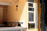 RV rental wood interior features power hub: Zamp Solar controller (14V) and 12V DC distribution for essentials.