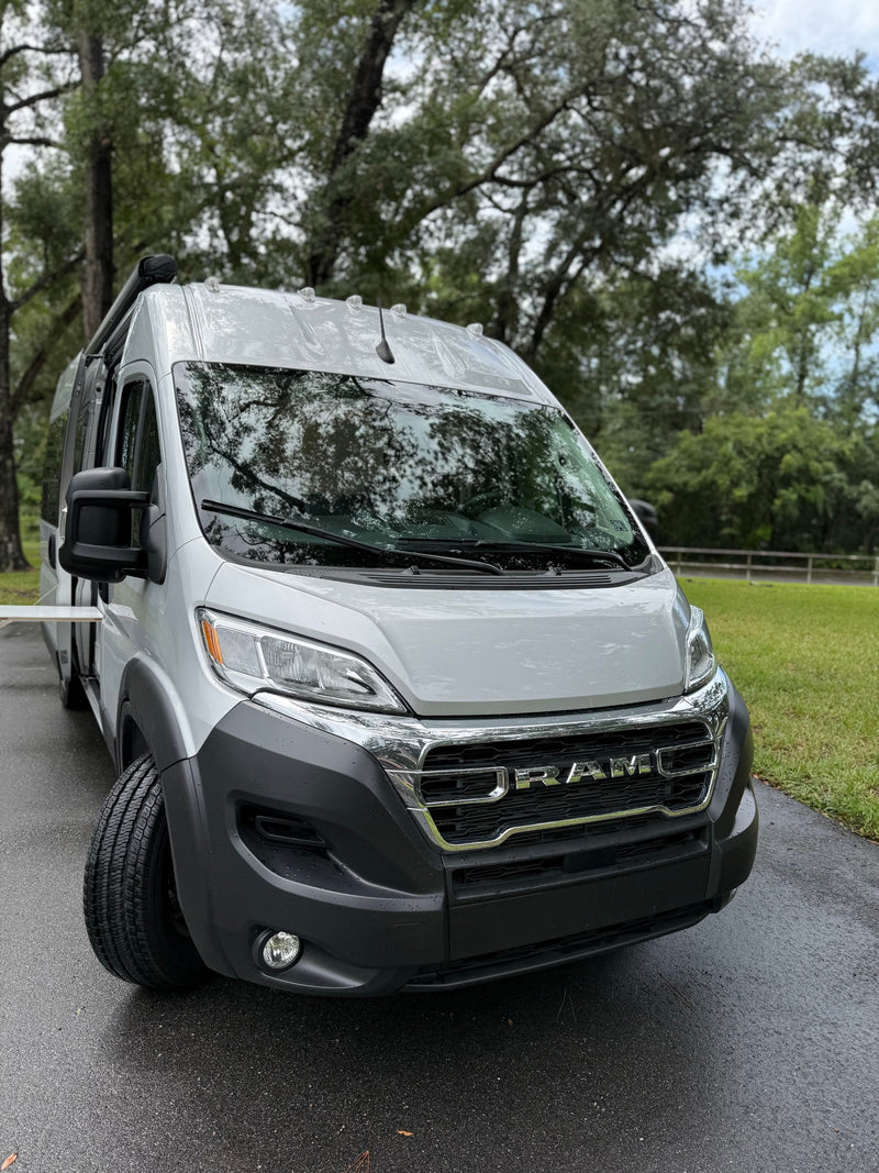  showcasing smart storage and organization for travelers.|This rv rental kitchen features a built-in Duxtop induction cooktop — photo 18