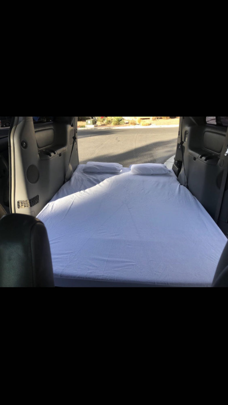  ideal for an RV rental or overland adventure.|White minivan with large rooftop cargo box and awning — photo 11