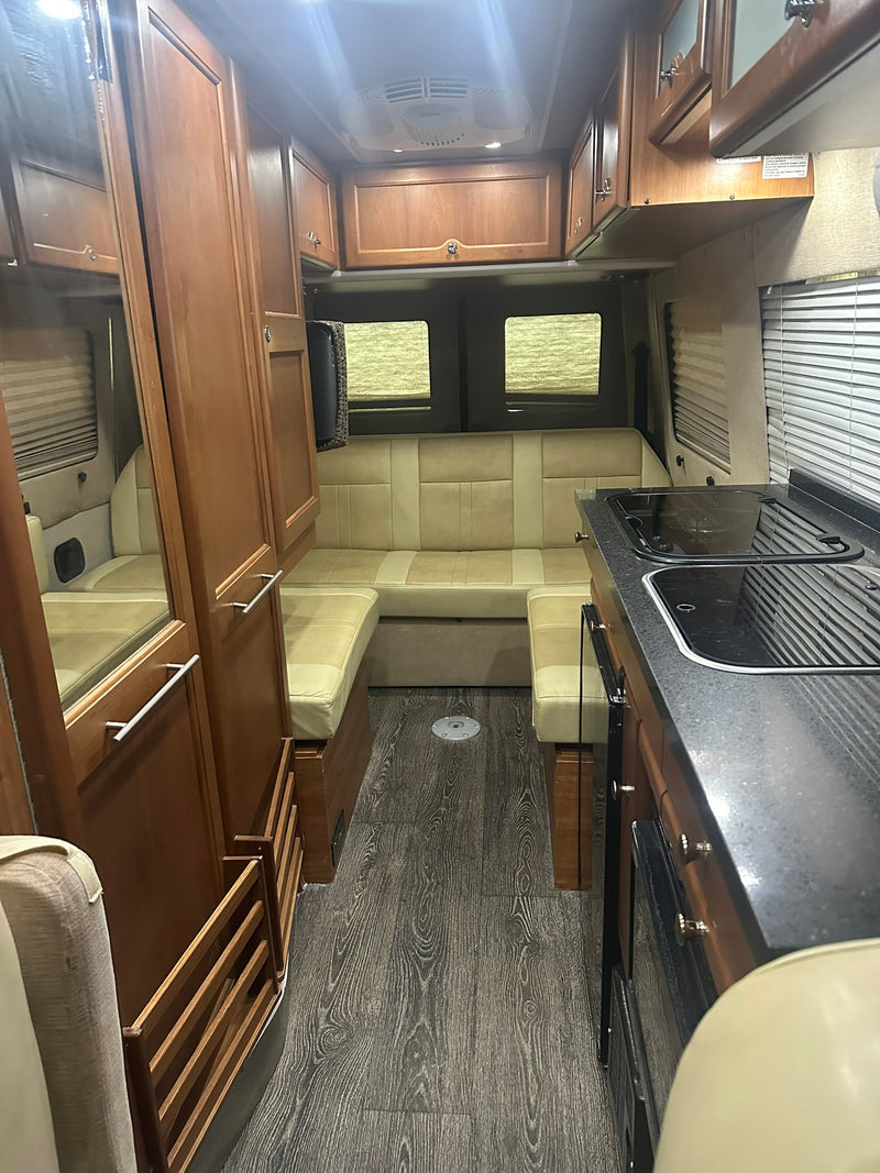  is an ideal rv rental for your next trip.|This tan Mercedes Sprinter rv rental camper van features an awning & tinted windows — photo 4