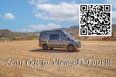 A gray RV rental camper van sits in a dirt lot with mountains. Scan the QR code for a 3D virtual tour of this adventure vehicle.