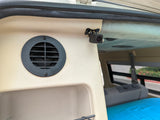 RV rental interior: beige paneling, security camera, and air vent. Blue mattress in rear for comfort.