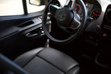 Interior of a premium **rv rental**, showing the Mercedes-Benz steering wheel, dashboard, and comfortable driver's seat.