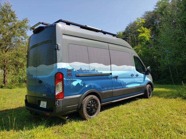 Experience the outdoors with this custom Ford Transit RV rental, featuring a unique mountain and forest mural.