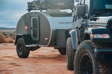 Off-road Jeep & Escapod TOPO teardrop camper (RV rental) in desert. Ready for adventure camping!