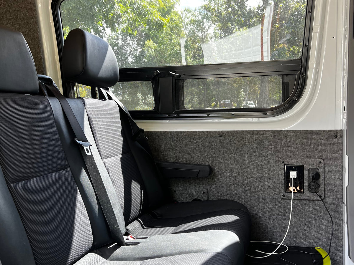  overlooking a suburban street.|Interior cab of an RV rental — photo 11