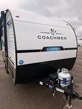 Front of a white Coachmen Clipper travel trailer, equipped with a propane tank, ready for an rv rental camping adventure.