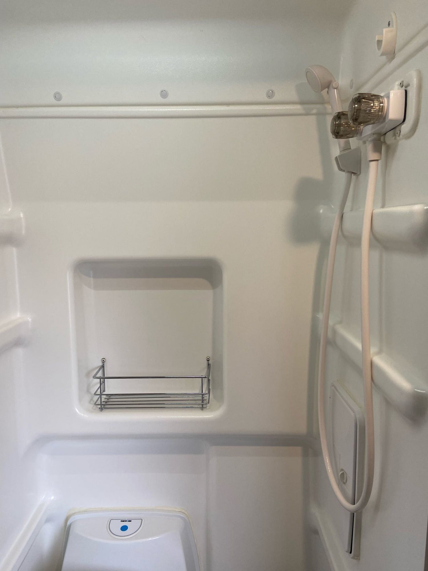  and climate controls.|This inviting RV rental interior features a compact kitchen — photo 6