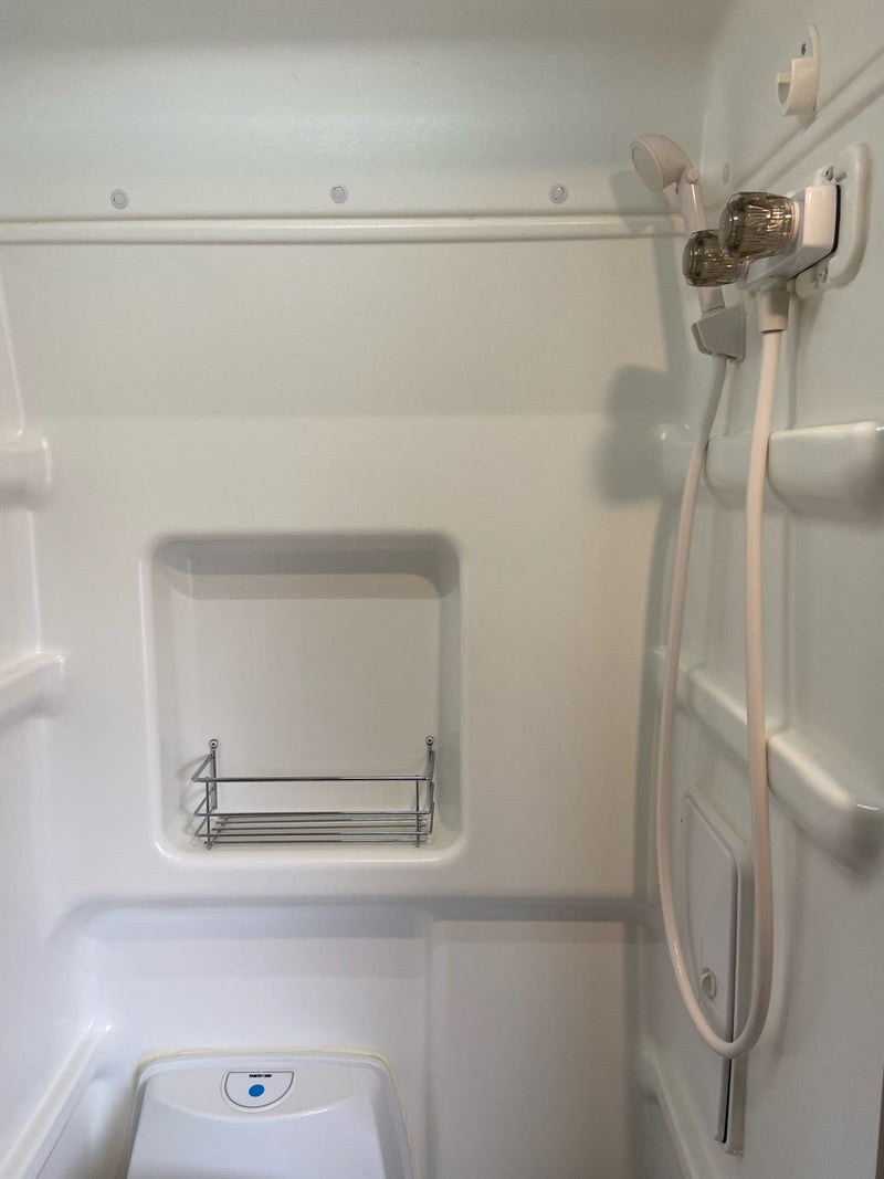  and climate controls.|This inviting RV rental interior features a compact kitchen — photo 6