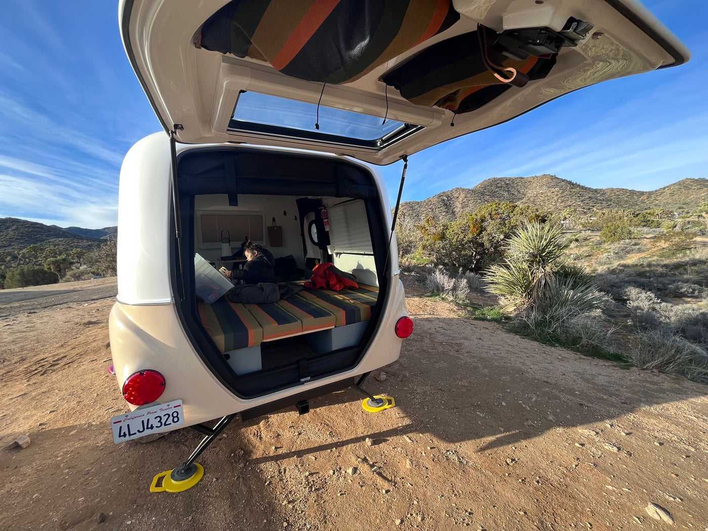  and bed. Ideal for travel.|This charming beige/tan RV rental — photo 11