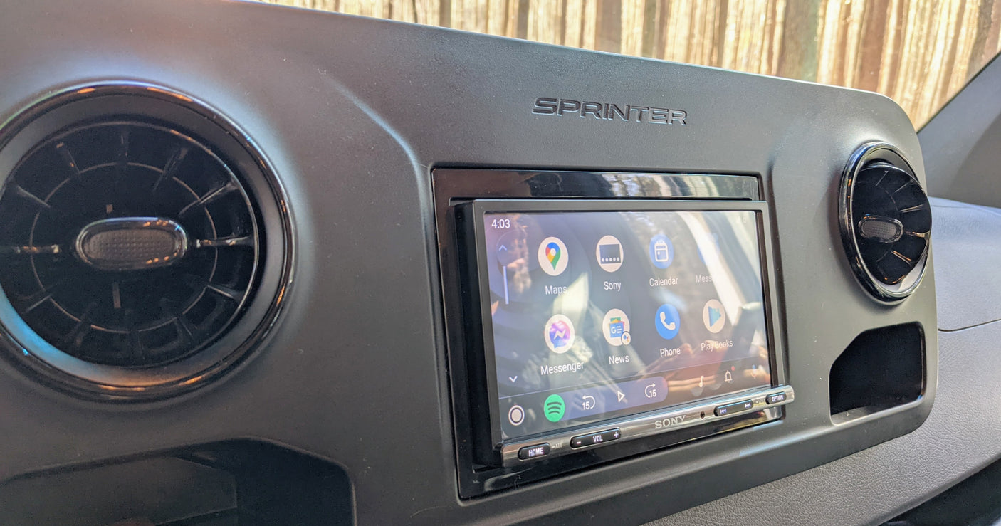 Dashboard of an RV rental Sprinter van, showing a Sony infotainment system with navigation, media, and phone apps.