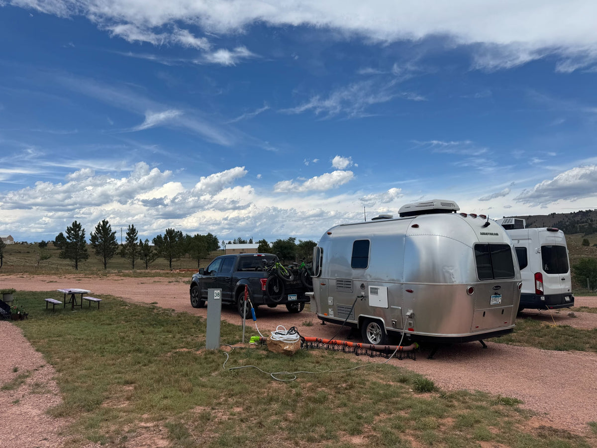  towed by a pickup truck carrying mountain bikes — photo 2