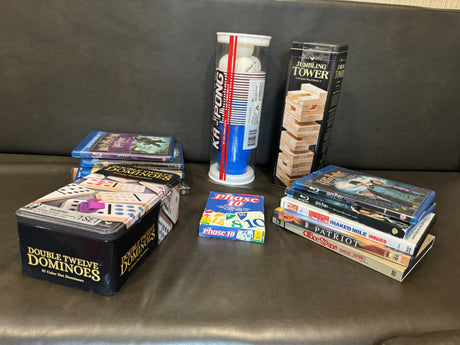 Games & movies perfect for an RV rental: Double Twelve Dominoes, Phase 10, Ka-Pong, Jumbling Tower, & Blu-rays/DVDs.