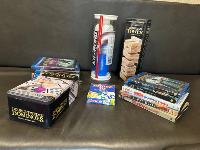 Games & movies perfect for an RV rental: Double Twelve Dominoes, Phase 10, Ka-Pong, Jumbling Tower, & Blu-rays/DVDs. — photo 2
