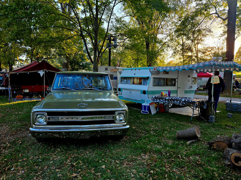 Experience nostalgia with this vintage Chevy truck & retro RV rental setup at a festive campground, complete with Halloween decor. — photo 12