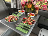 Fresh seared tuna salads, fruit bowls, and Hawaiian drinks in an RV rental. Enjoying a gourmet meal during a road trip.