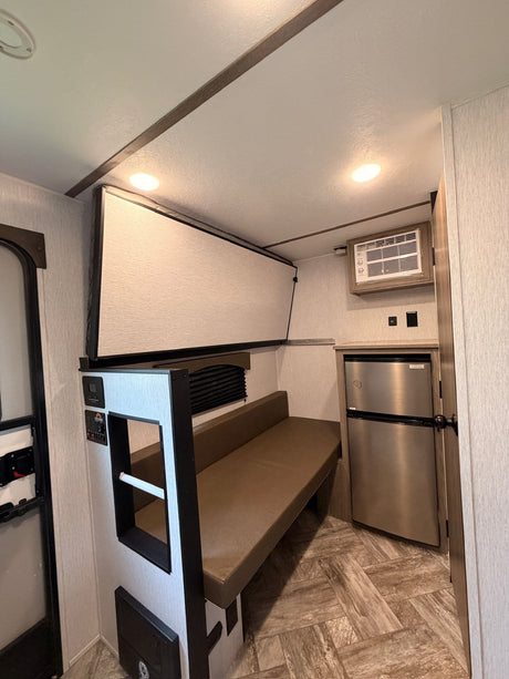  ready for your travels.|Cozy RV rental interior featuring a bed