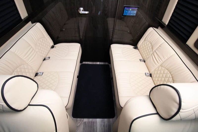  and large windows.|This luxury RV rental interior features plush captain's seats — photo 9