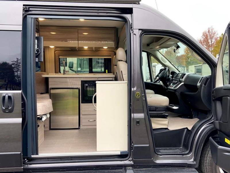  and beds.|Step inside this modern rv rental camper van — photo 3
