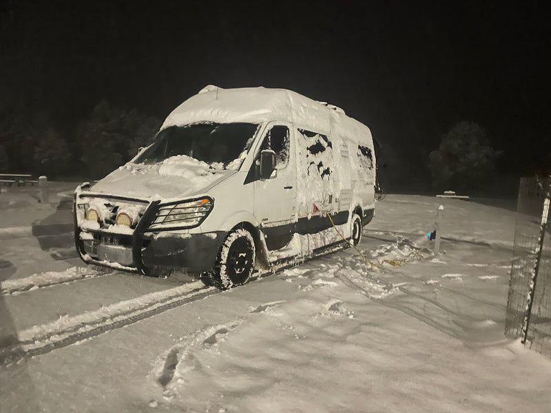  revealing a cozy wooden interior and fire extinguisher. Perfect for travel!|A white RV rental — photo 2
