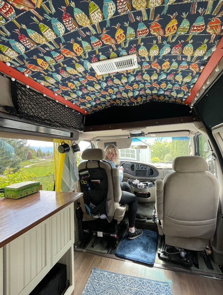  and bright window view.|An RV rental van by a serene river