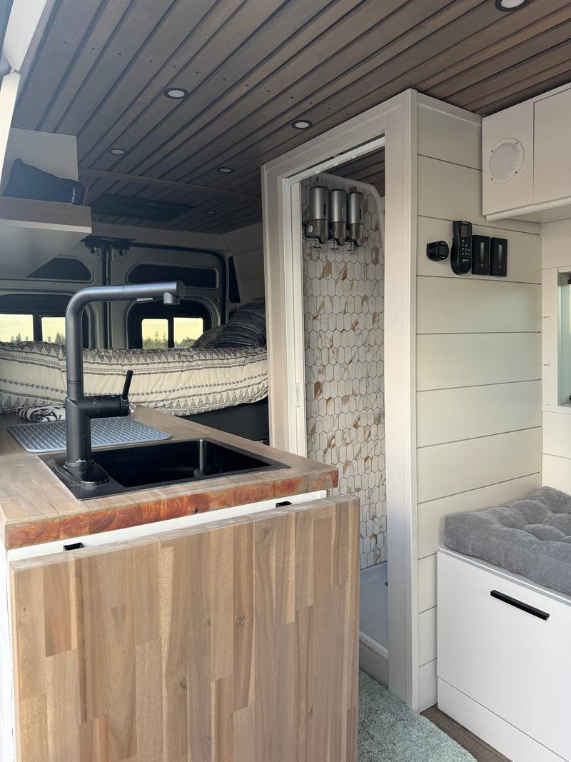  showcasing its custom-built interior with a kitchen area — photo 2