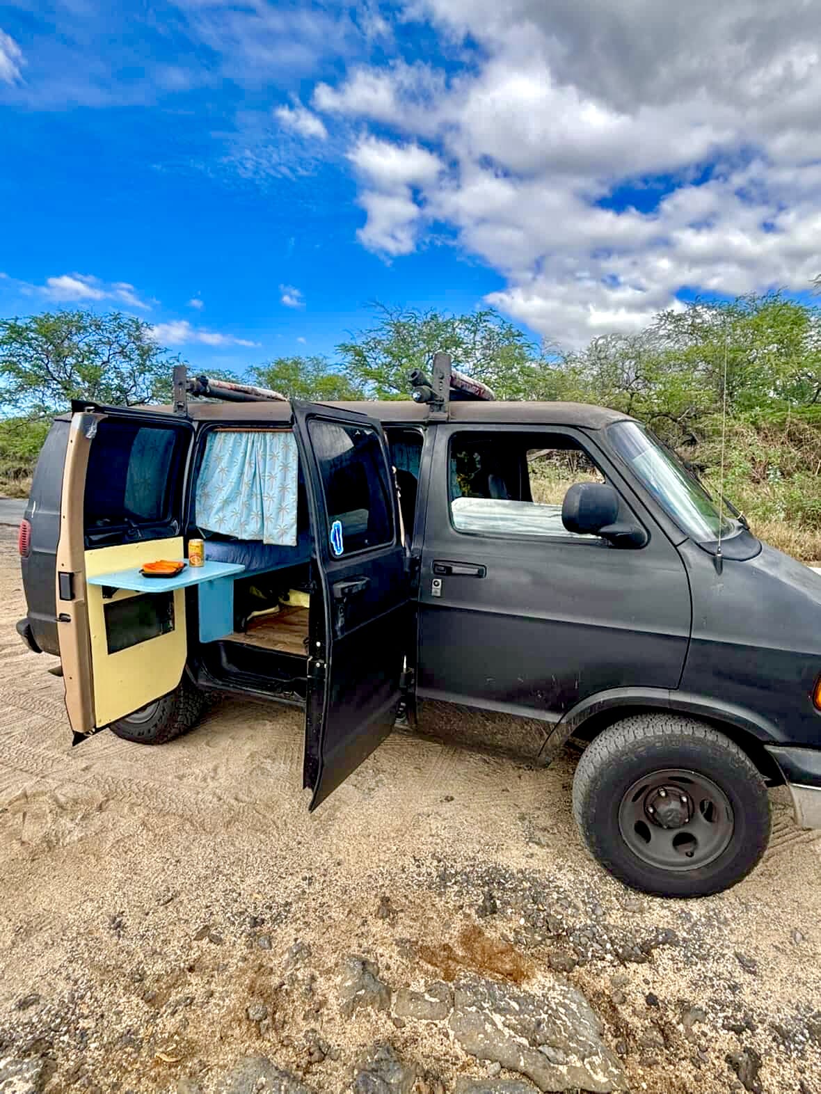 Black camper van with doors open