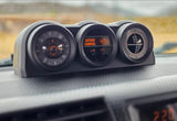 Car dashboard with a compass, 48°F outside temperature, and inclinometer, essential for any rv rental adventure.