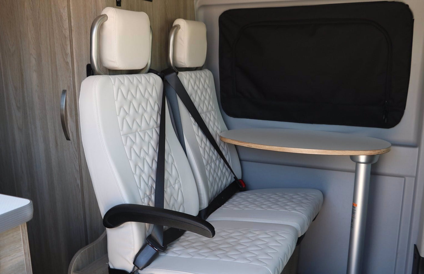  and storage.|This gray Winnebago Solis RV rental van