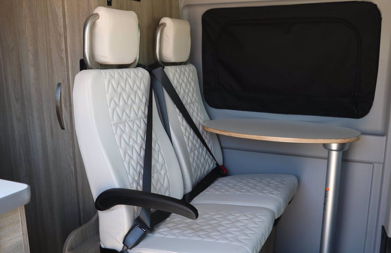  and storage.|This gray Winnebago Solis RV rental van — photo 1