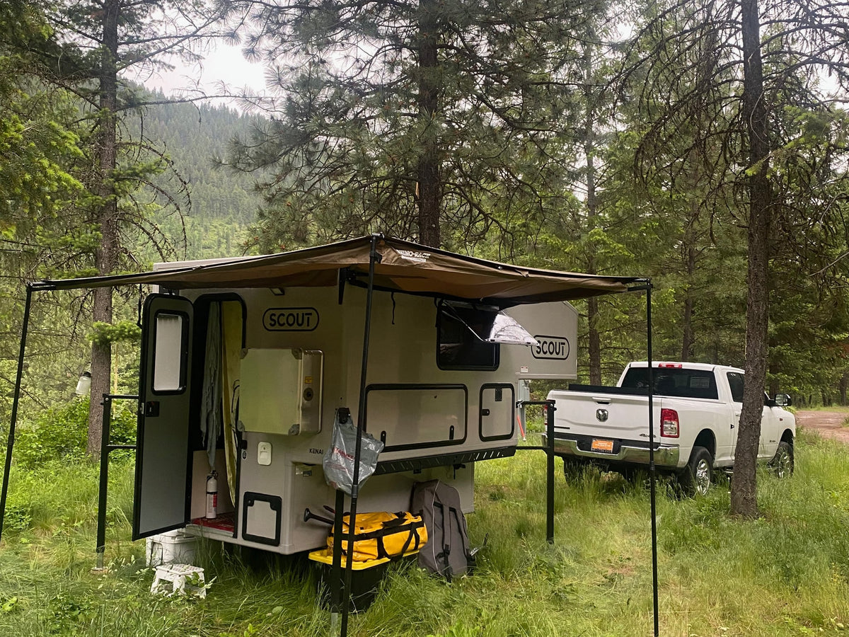  featuring a Rhino-Rack awning. Perfect for an RV rental adventure.|Scout truck camper setup with an awning — photo 2