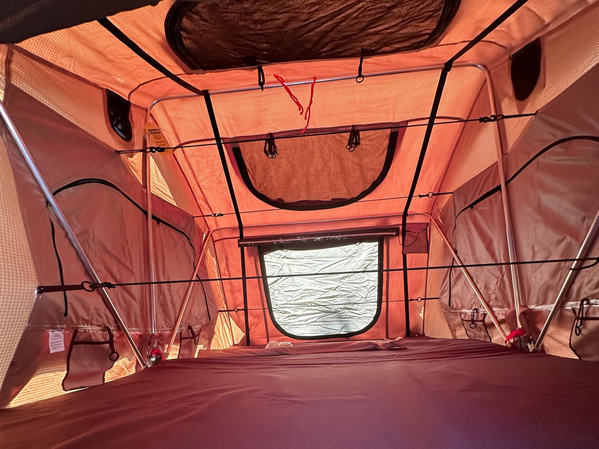 an RV rental alternative for diverse camping and outdoor travel.|Interior of a spacious rv rental rooftop tent — photo 4