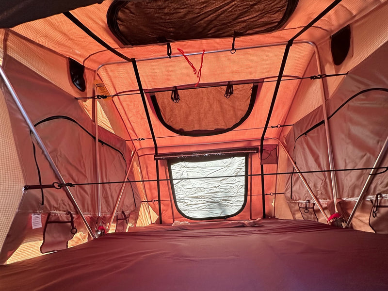  an RV rental alternative for diverse camping and outdoor travel.|Interior of a spacious rv rental rooftop tent — photo 4