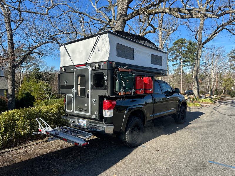  perfect for a rugged rv rental adventure.|Adventure-ready truck camper setup at a Shell station — photo 6