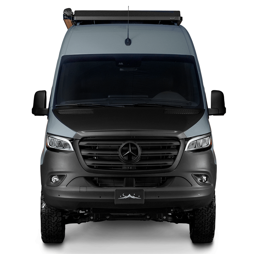 Frontal view of a sleek gray Mercedes-Benz Sprinter camper van with a roof rack and off-road tires. Great for rv rental.