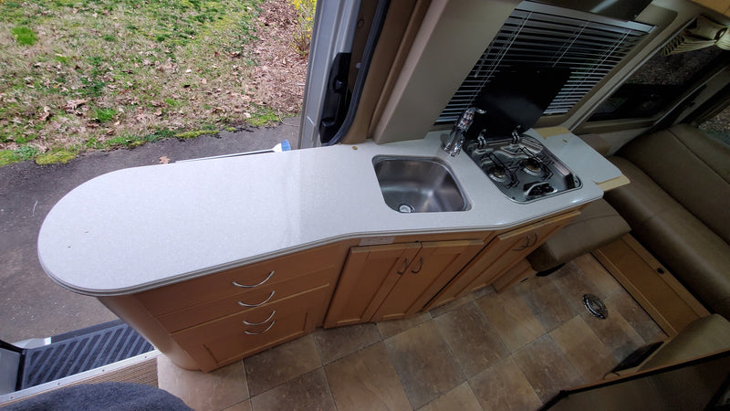  a Mercedes Sprinter camper van with open doors — photo 8