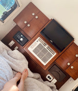 RV rental: Cozy overhead view of a bedroom with built-in wood, AC, TV, & stereo. Ideal for travel comfort.