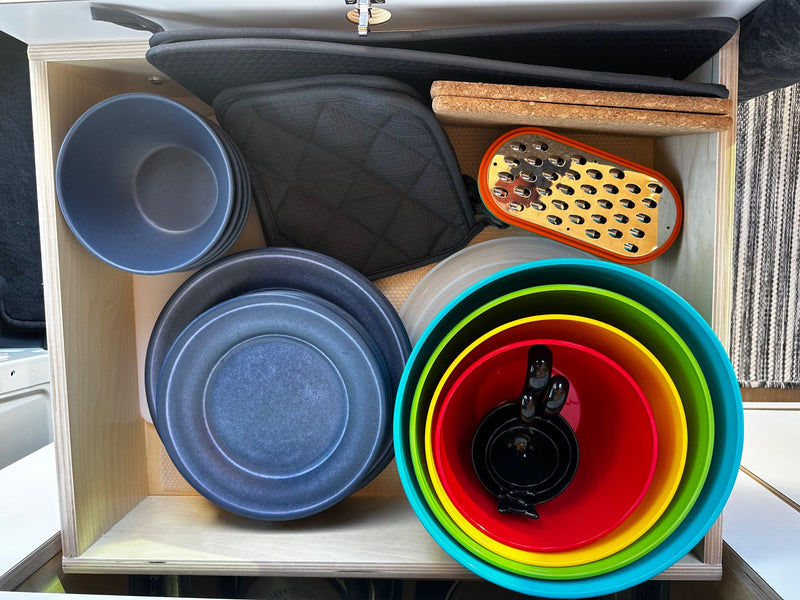  and rear windows.|Spacious RV rental interior featuring a full kitchen — photo 9