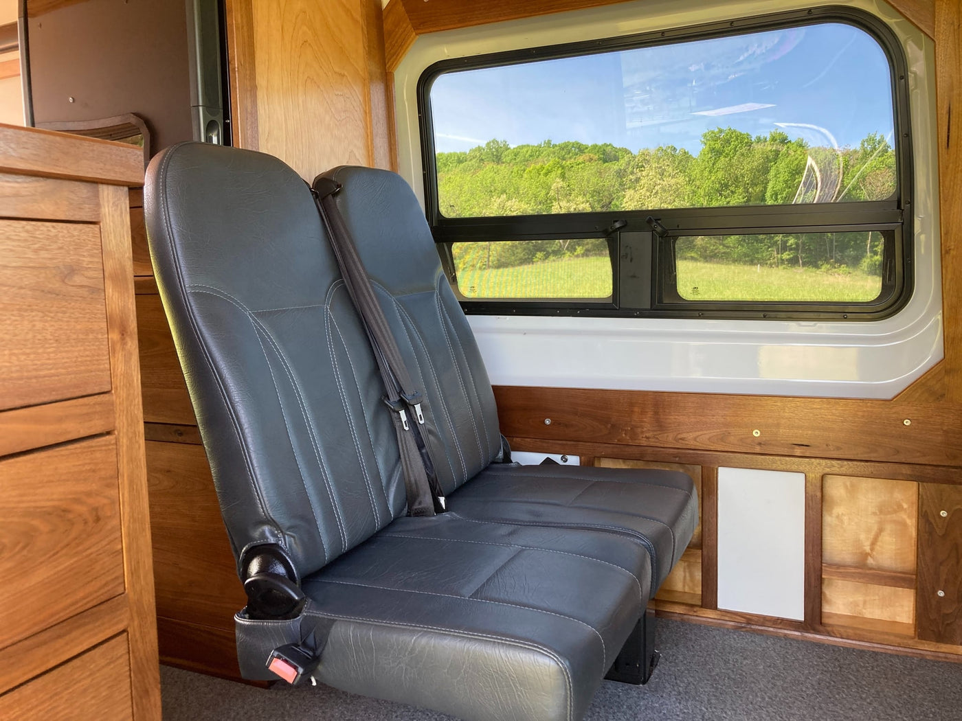  ready for outdoor adventures.|This RV rental's custom van conversion reveals a cozy bed — photo 5