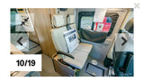 RV rental interior: A compact camper van featuring adaptable bench seating and a bed frame. Perfect for trips!