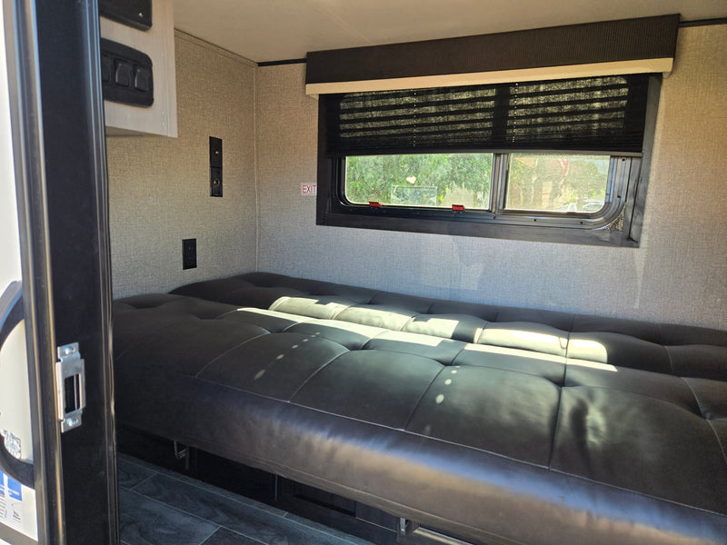  ideal for rv rental. Its open door reveals a cozy interior — photo 5