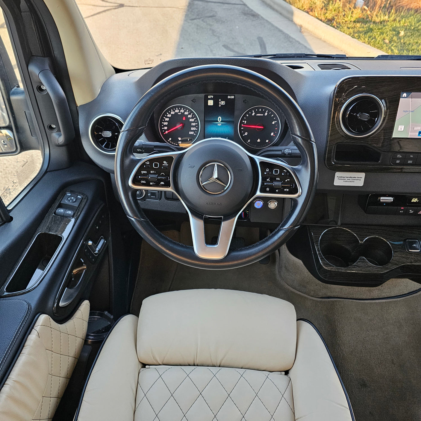 Driver's seat view of a modern Mercedes-Benz van cockpit, perfect for your next RV rental trip.