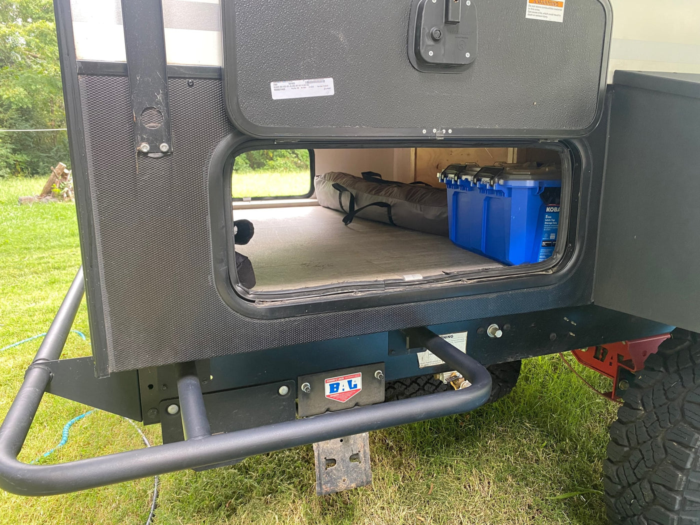  and a window with scenic view.|Cozy RV rental bunk bed features a safety rail — photo 15