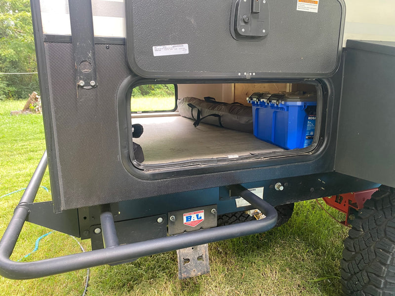  and a window with scenic view.|Cozy RV rental bunk bed features a safety rail — photo 15