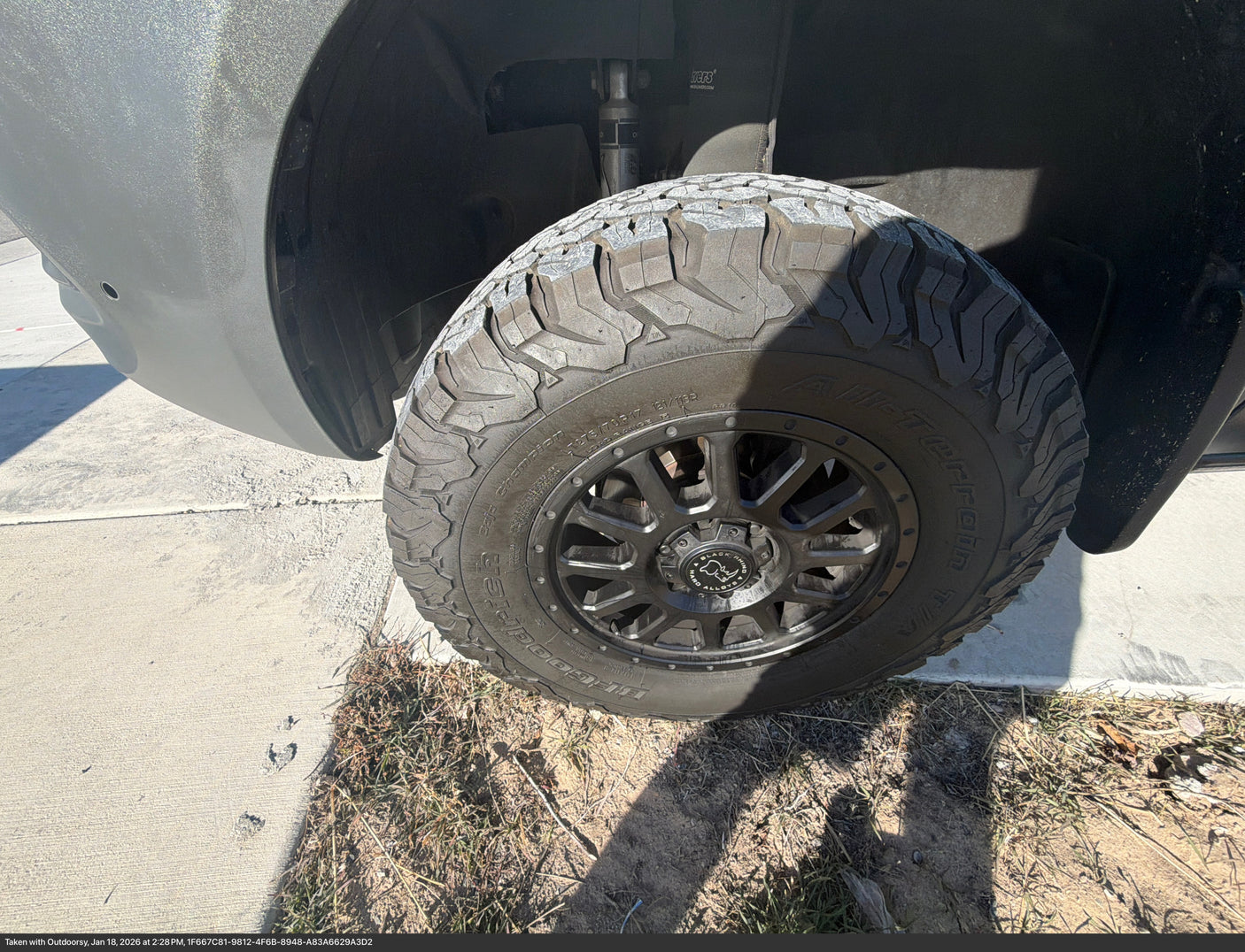 Close-up of a BFGoodrich off-road tire and Black Rhino wheel on an RV rental, highlighting its rugged capability.