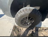 Close-up of a BFGoodrich off-road tire and Black Rhino wheel on an RV rental, highlighting its rugged capability.