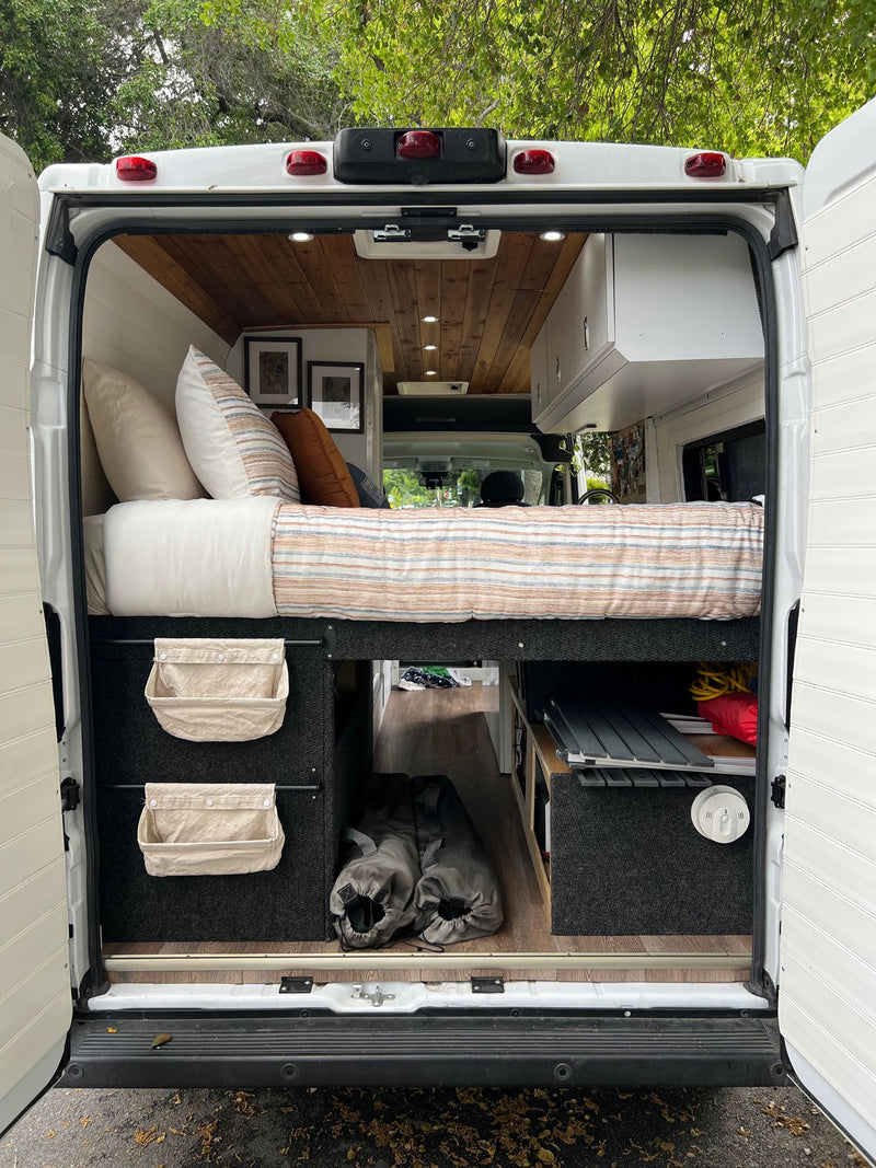  +14.5A (197W) input. Key for any RV rental.|This RV rental van features a cozy bed — photo 11