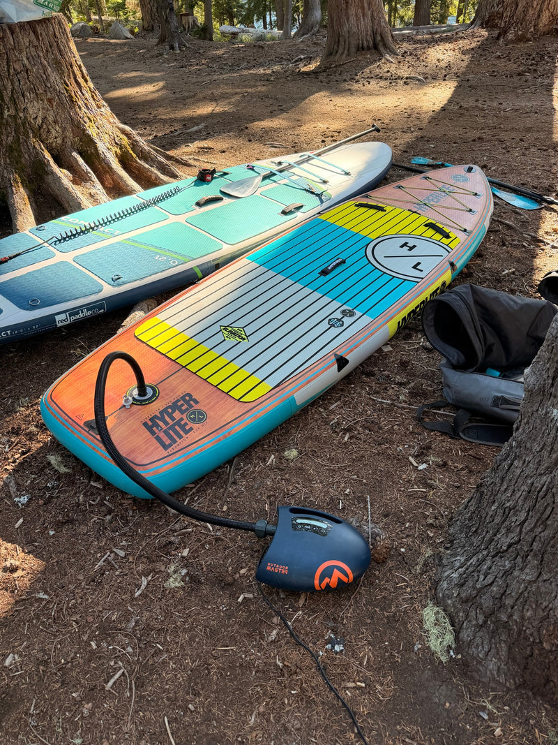 Two SUPs being inflated with an electric pump (Outdoor Master) in a wooded RV rental campsite. Ready for adventure! — photo 20