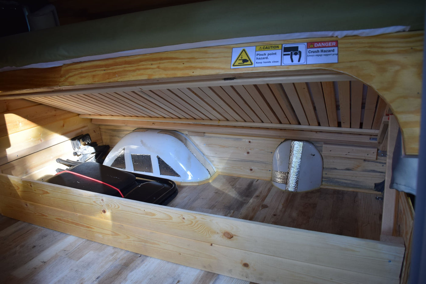  overlooking trees.|Cozy rv rental camper van interior with a mobile office setup — photo 11
